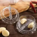Manual garlic twister kitchen garlic press clear plastic garlic maser tool for cooking food. - Clear