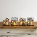 Set of four rustic wooden LED light-up Christmas houses with snow-covered roofs - Four-Piece Set / 4Pcs Snowy Roof Small Wooden House Set