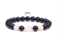 Detail view of 8mm blue sandstone and white stone beaded yoga bracelet with metal spacers. - Style 4