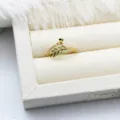Close-up of gold leaf-shaped ring mount with green enamel for DIY jewelry making. - Green Leaf Style