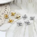 Detailed close-up showing gold and silver mini flower charms for DIY jewelry and crafts. - Four-Petal Flower (10.5x12.5mm)