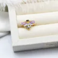 Close-up detail of the colorful enamel bee design on an adjustable 18K gold plated ring. - Bee Style