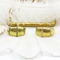 Macro view of 18K gold plated rings with micro-pave stones and textured bands. - Simple Textured Style / White Zirconia Simple