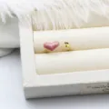 Macro close-up of pink enamel heart ring with DIY pearl setting in 18K gold plated copper - Pink Heart Style