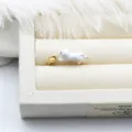 Macro detail of adjustable 18K gold-plated enamel cat ring with DIY pearl setting base - White Cat Style