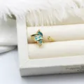 Detailed view of an enamel butterfly adjustable ring with gold plating and zircons - Green Butterfly Style