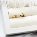 Close-up of 18K gold plated adjustable ring bases with enameled cartoon and flower designs. - Clownfish Style