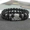 Gedetailleerd overzicht van de zwarte kralen yoga armband in twee delen met Boeddha hanger. - Kleur 3