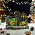 Glowing Christmas snow house music box with tree and figures, 28x23x11cm dimensions - Town Musical Box