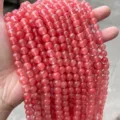 Macro detail of watermelon red round synthetic crystal beads for DIY jewelry making. - 4mm (Approx 90pcs) / Watermelon red