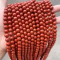 Vista macro detallada de cuentas redondas de jaspe rojo natural para la creación de joyas DIY - 4mm (aprox. 90pcs) / Jaspe Rojo Natural 5A