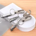 Stainless steel nail clipper keychain set with ear pick, portable multi-function keyring tool. - Default