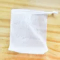 White double layer mesh foaming net for facial cleanser and handmade soap with drawstring closure. - Soap Saver Bag with White Rope