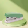 Green desktop stapler for office and school use, compatible with standard 24/6 and 26/6 staples. - Green
