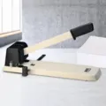 Heavy-duty 2-hole paper puncher with 200-sheet capacity, 80mm spacing, durable metal office tool. - Black and White