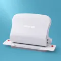 White manual multi-hole paper puncher for loose-leaf binding, efficient office stationery tool. - White
