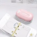 Pink mini 3-hole punch for loose-leaf notebooks with 28mm hole spacing, compact and portable. - Pink