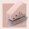 Pink mini single hole puncher, portable manual paper punching tool for office school stationery. - Pink