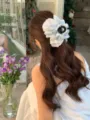 Detail view of a large floral cloud bubble hair claw clip with pearls on long hair - Blue New Chinese Floral Cloud