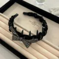 Elegant black velvet headband with rhinestone bow and spikes for high crown volume - Bow