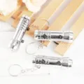 Portable silver mini flashlight keychain with dual purpose design and metal ring for everyday use. - Silver