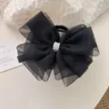 Elegant black mesh bow hair claw clip featuring delicate pearl center for women - Black