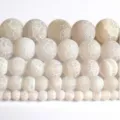 Close-up detail of white crackled agate round beads for DIY jewelry making and bracelets. - 6mm/Approx 60pcs / Style 3