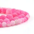 Pink weathered agate round loose beads macro detail shot for DIY handmade jewelry crafting. - 9