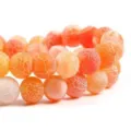 Close-up detail of orange crackled agate loose beads, perfect for DIY jewelry making and bracelets. - 10
