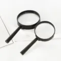 Lente d'ingrandimento portatile in plastica nera con lente ottica trasparente per la lettura. - 50mm / Nero
