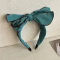 Elegant teal blue green wide headband featuring a large layered 3D bow design for women - Peacock Blue