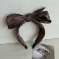 Elegant brown wide-edge headband featuring a large decorative butterfly bow design - Brown
