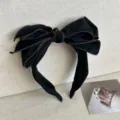 Chic black 3D bow headband with brown trim for a high skull top hairstyle look - Black