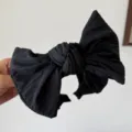 Bandeau élégant à gros nœud en tissu noir texturé pour un effet tête haute chic - Noir