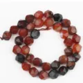 Close-up detail of faceted red carnelian gemstone loose beads for DIY jewelry making. - 38