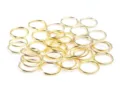 Gold metal jump rings detail shot, ideal for DIY jewelry making, earrings, and beading crafts. - 0.5*3mm 500pcs/Pack / Gold