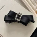 Elegant black satin bow hair banana clip with a sparkling rhinestone buckle detail - Cross Over Bow with Square Rhinestone / Black