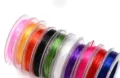 Cordón elástico de colores para la bisutería DIY, detalle de la bobina de hilo elástico. - Multicolor
