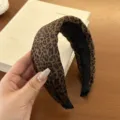 Detailed view of a wide velvet headband with a leopard print pattern and sponge padding - Smooth Sponge