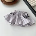 Elegant ethereal pleated fabric hair clip with black bows and pearl accents in light grey - Purple
