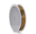 Vista dettagliata di filo di rame dorato avvolto su rocchetto bianco per creazione gioielli. - 0.3mm 15m / Oro