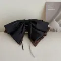 Grande pince à cheveux avec nœud en ruban satin noir et léopard pour coiffures élégantes. - Pince à Queue de Cheval Patchwork Léopard Marron