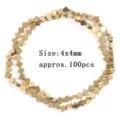 Close-up detail of golden four-leaf clover hematite beads, ideal for 4x4mm accessories. - Four-leaf Clover Shape