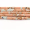 Pink imperial jasper tube beads macro detail view showing the unique natural marbled pattern texture. - 27