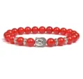 Red agate bead bracelet with silver Buddha head charm, detailed closeup view for men and women gift. - Red Agate