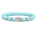 Detailed view of turquoise amazonite bead bracelet with silver Buddha head and metal spacers. - Amazonite