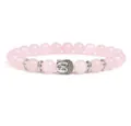 Close-up product detail view of natural pink crystal beaded bracelet with silver Buddha charm. - Rose Quartz