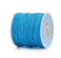 Vista dettagliata della bobina di filo di giada in nylon blu vivace, ideale per gioielli fai da te. - 0,8 mm 45 m / Blu Lago Scuro