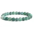 Green cracked agate beaded bracelet detail, natural gemstone stretch jewelry close-up. - Green