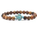 Natural stone tiger eye beaded bracelet with turquoise turtle charm 8mm closeup jewelry detail view - Yellow Tiger Eye
